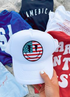 "The perfect hat for summer! Now you can purchase my most popular American Flag Smiley Patch already attached to a hat. ✳Size: one size fits most, with snaps to make it larger or smaller! ✳Color: White ✳Kind: Trucker hat ✳INCLUDES ONE HAT WITH PATCH ON IT IMPORTANT Once your order is shipped I am not responsible/liable for the package. The United States Postal Service is responsible for delivery. If there are any problems with the delivery or a missing package, please reach out to me and I will Trendy Summer Hats For Streetwear, Trendy Summer Streetwear Hats, Trendy White Baseball Cap For The Beach, Summer Streetwear Sun Hat With Curved Brim, Trendy White Baseball Cap For Beach, Casual Baseball Cap For Summer Streetwear, Adjustable Sun Hat For Summer Streetwear, Casual Summer Baseball Cap For Streetwear, Adjustable Sun Hat For Streetwear In Summer