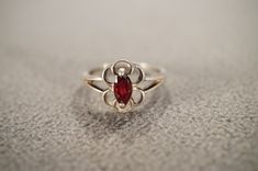 I am offering you this vintage sterling silver wedding band stacker design ring.  This features a raised relief  single stone setting.  This has a prong set marquise shaped genuine Garnet stone set in it.  This ring is currently a size 7 3/4, though I am sure it could be sized up or down. Please review all of my pictures, as they are all a very important part of , my listing/descriptions. Vintage Stackable Jewelry With Round Band, Vintage Round Band Stackable Rings, Vintage Stackable Rings For Formal Occasions, Vintage Engraved Stackable Round Ring, Vintage White Gold Stackable Jewelry, Vintage Sterling Silver Stackable Rings Stamped 925, Vintage Stackable Jewelry For Promise Ring, Vintage Stackable Jewelry For Anniversary, Vintage Sterling Silver Engraved Toe Ring