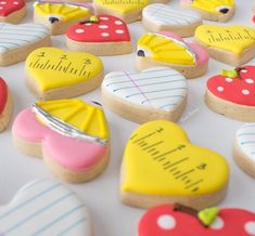 many decorated cookies on a table with numbers and hearts in the shape of heart shapes