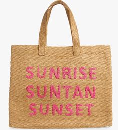 a straw bag with pink writing on the front and bottom that says sunrise, suntant, sunset