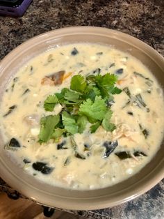 a bowl filled with soup and garnished with cilantro