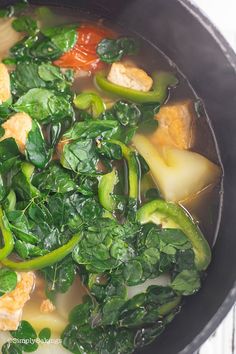 a pot filled with vegetables and meat in broth