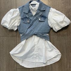 Washed Denim Wrap Around Vest With Short-Sleeve Shirt. Denim Vest Is Adjustable Closure. Casual White Cotton Denim Top, Fitted Short Sleeve Denim Top For Fall, Short Sleeve Denim Vest For Spring, Short Sleeve Denim Blue Vest For Spring, White Denim Short Sleeve Top, Spring Medium Wash Short Sleeve Denim Vest, White Fitted Denim Vest, White Short Sleeve Denim Tops, White Casual Denim Top For Spring