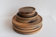 a stack of wooden bowls sitting on top of each other