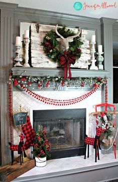 a fireplace decorated for christmas with red and white decorations