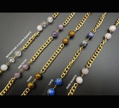 Elevate your sunglasses/eyeglasses look with a unique brass chain embellished with a variety of beads and gemstones including amethyst, rose quartz, moonstone, clear quartz, lava, lapiz, tiger, and more. Our luxurious chains can function as a sunglasses chain, eyeglasses chain, mask chain, necklace, or body chain. CHAIN FEATURES: - A variety of beads and gemstones (15 to 20 beads per chain) with two lobster clasps and rubber bands / elastics to connect to the glasses. - A beautiful brass chain in gold color (the chain is not polished so it would become more antique/vintage looking over time). - Can be used for your sunglasses, eyeglasses, as necklace, body chain, or to hold your mask.  - A velvet pouch for storage CHAIN DETAILS: - All chains are 30 inches in length - All chains are made of Metal Glasses Chains As Gift, Elegant Metal Beaded Glasses Chain, Bohemian Gold Beaded Glasses Chains, Elegant Handmade Metal Glasses Chains, Metal Glasses Chain With Adjustable Chain As Gift, Beaded Metal Glasses Chains As Gift, Metal Beaded Glasses Chains As Gift, Metal Beaded Glasses Chains For Gifts, Handmade Metal Glasses Chains As Gift