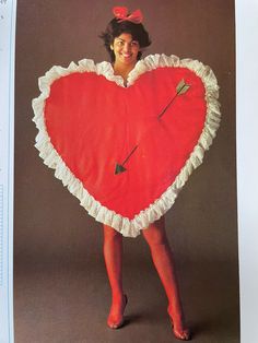 a woman wearing a heart shaped costume