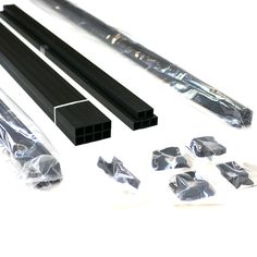 several pieces of metal are shown in this image, including one piece of black plastic and the other part of clear plastic