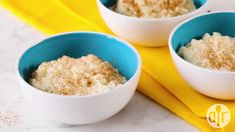 three bowls filled with oatmeal sitting on top of a yellow napkin