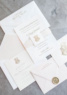 the wedding stationery is laid out and ready to be put into their guests'envelopes