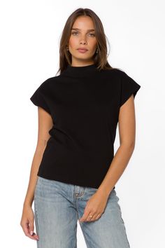 Expertly designed for comfort and style, the Elizette Tee features a mock neck and short sleeves for a sophisticated look. Stay on trend while feeling confident and chic in this must-have wardrobe staple. Material: 100% Cotton Color: Black Machine wash cold Model is 5'9'' and is wearing a size S Imported Velvet Heart, Feeling Confident, White Button Up, Staple Pieces, Black Tee, Wardrobe Staples, Mock Neck, Button Up Shirts, Short Sleeves