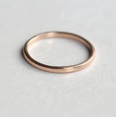 a close up of a ring on a white surface