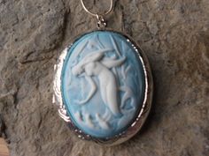 For sale are perfectly detailed, flawless (white colored mermaid on a blue background) cameo pendant lockets!!! Gorgeous!!!  The silver plated locket has victorian etching on both the front and back, and is 2" long x 1 1/2" wide, and can hold two photos or a treasured keepsake!!! They are offered at a reasonable price, make perfect gifts, and are wonderful quality!!!  The chain is 22" .925 silver plated 1.2mm snake chain, with a lobster claw clasp!!!!  I make several varieties, colors, styles an Lockets Silver, Lady Of The Sea, Mermaid Siren, Tropical Jewelry, Pendant Locket, Silver Locket, Cameo Jewelry, Cameo Brooch, Cameo Pendant