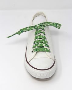 These beautiful floral 100% cotton shoelaces will cheer up the dullest of days and are perfect for any outfit!. Just pop them in like any pair of laces and enjoy them. So Retro and so on-trend! These laces are approx. 110 cm long and will fit any standard pair of plimsolls / sneakers up to 5 pairs of eyelets. The laces are sealed at the ends in the same way as commercial laces, but oh so much more fancy!  These can be made longer or shorter on request (please leave a message on checkout specifying the size required). These make fantastic unusual wedding favours and can be made in bulk to your specification - please ask for details.  Your guests will be talking about them for years to come ... To view the full range of Janeyjonks Floral Shoelaces follow this link - https://etsy.me/3dHVK5D T Unusual Wedding Favours, Etsy Shop Names, Retro Vintage Style, Green Item, Cheer Up, Work Shoes, Yellow Floral, Canvas Shoes, Summer Shoes