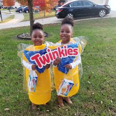 two children dressed up as twinkies standing in the grass