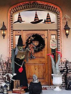 a front door decorated for halloween with decorations