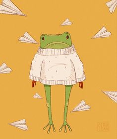 a frog wearing a sweater and standing in front of paper airplanes