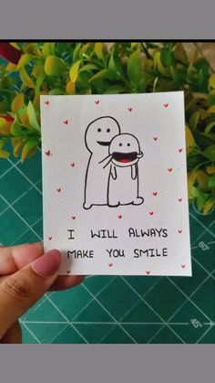 someone holding up a card that says i will always make you smile