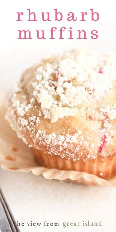 a close up of a muffin on a napkin with a fork in front of it