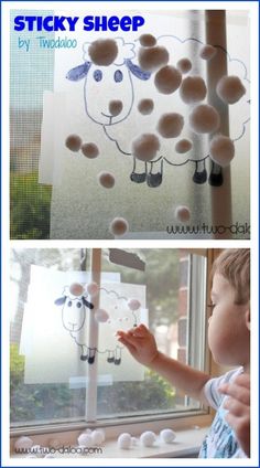 a child is playing with sticky sheep on the window sill and looking at it