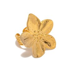 a gold flower ring on a white background