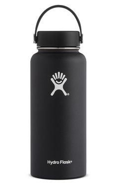 the hydro flask water bottle is green and has a black lid, with a white logo