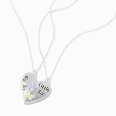 Celebrate sisterhood with this sensational necklace set. The split-heart design says "Big Sis" on one half and "Little Sis" on the other with yellow and purple butterflies. Keep a half to yourself and surprise your little or big sister with the other. Pack Size: 2 Finish: Silver-tone Length: 16 + 3 in. extender / 40.64 + 7.62 cm. extender Closure: Lobster clasp Material: Metal - Claire's Best Friends Big Sis & Little Sis Butterfly Split Heart Pendant Necklaces - 2 Pack Personalized Double Heart Necklaces For Friendship, Personalized Double Heart Friendship Necklace, Personalized Heart Necklaces For Friendship, Personalized Heart-shaped Necklaces For Friendship, Silver Double Heart Necklace For Friendship, Personalized Heart Necklace For Friendship, Heart Charm Necklace For Mother's Day And Friendship, Best Sister Ever, Sister Necklace