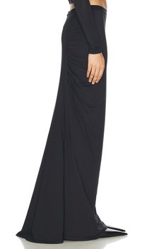 80% nylon 20% lycra.  Made in China.  Machine wash.  Unlined.  Pull-on styling with elastic waistband.  Jersey fabric with ruching detail.  .  .  .  .  .  .  .  .  .  . Stretch Draped Bottoms For Night Out, Ruched Maxi Skirt For Formal Occasions, Chic Draped Fitted Maxi Skirt, Elegant Ruched Skirted Bottoms, Flowy Ruched Maxi Skirt, Elegant Skirted Bottoms With Ruched Details, Chic Skirted Bottoms With Gathered Waist, Chic Fitted Ruched Maxi Skirt, Elegant Stretch Ruched Skirt