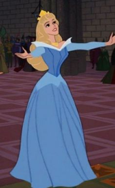 a woman in a blue dress is dancing