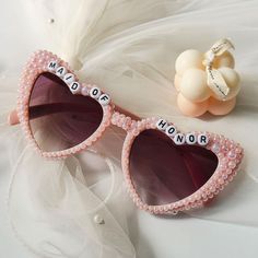 Very beautiful fully customizable unique Pearl glasses Great for concerts/sports/birthdays/bachelorette parties/weddings/masquerade Custom words or lyrics Very suitable for gifting to good friends, sisters and family members Please leave me a message if you have any questions! It is best to customize 2-4 short words on the glasses. Please leave me a message for more words. Bridesmaid Sunglasses, Sunglasses Bachelorette, Bridal Sunglasses, Pearl Glasses, Bridesmaid Glasses, Glasses Wedding, Sports Birthday, Les Sports, Short Words