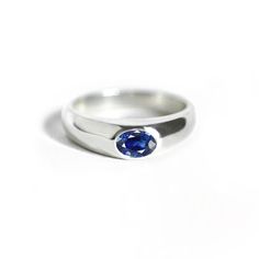 "14k Solid White Gold Oval Sapphire Engagement Ring Minimalist Fine Blue Sapphire Gold Ring Wedding Anniversary Gift For Her Daily Wear * Made To Order Ring Size: All Size Available Metal : 14K Solid White Gold (Stamped) / Option available in 18K Gemstone: Blue Sapphire * Blue Sapphire Weight : 0.40 ct * Gemstone Shape : Oval * This ring is 5.5 mm wide at the top and 3.5 mm wide at the base * Rings also available in other gemstone for enquire please contact with us ★ All our products come packag Minimalist Sapphire Ring With Tension Setting For Formal Occasions, Minimalist Sapphire Ring With Tension Setting, Modern Sapphire Ring Oval Cabochon Polished Finish, Modern Sapphire Ring With Oval Cabochon And Polished Finish, Modern Sapphire Ring With Oval Cabochon, Modern Oval Cabochon Sapphire Ring, Classic Oval Sapphire Ring With Polished Finish, Minimalist Round Cut Sapphire Ring For Formal Occasions, Modern Gemstone Signet Ring