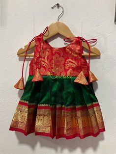 READY TO DISPATCH. Size available-0-3 years The yoke portion of the frock is made of floral weaved silk fabric and the skirt portion is made of Kanchipuram silk fabric. The dress is fully lined with cotton fabric. The stitches are concealed. The frock is from our new collection "Papa Ki Pari'. Please Visit Our Shop For More Unique Collection https://www.etsy.com/shop/Chitralie BUYER'S PLEASE LEAVE YOUR CONTACT NUMBER. It's necessary for shipping Traditional Navratri Dresses With Ruffles, Traditional Ruffled Dresses For Navratri, Festive Green Yoke Sets, Cradle Ceremony, Pattu Pavadai, Frock Designs, Half Saree Lehenga, Dress For Baby, Baby Skirt