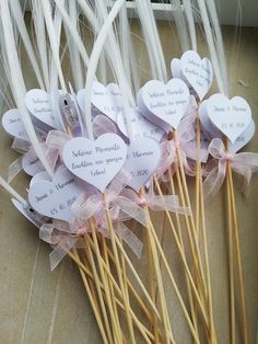 several heart shaped stick with names on them