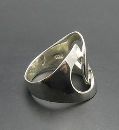 Sterling silver ring 925/1000. Stamped 925. Approximate weight 7.0 grams. Top width 2.0cm All our jewels are made from solid sterling silver 925/1000 and are carefully crafted by hand in our family workshop. We dispatch your orders in 5 working days, worldwide and the postage is $5. We ship registered priority mail. Please allow 5-7 working days for delivery in Europe and 10-15 working days outside Europe. For any questions - please do not hesitate to contact me! Modern Wide Band Sterling Silver Signet Ring, Elegant Silver Sterling Silver Signet Ring, Sterling Silver Wide Band Ring Stamped 925, Sterling Silver Ring With Shiny Finish, Polished Sterling Silver Rings, Elegant Sterling Silver Wide Band Ring With Open Band, Elegant Sterling Silver Wide Band Signet Ring, Formal Sterling Silver Rings With Polished Finish, Elegant Wide Band Open Ring Stamped 925