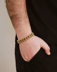 Upgrade your wrist game with our exclusive Bolt Chain Watch Band Bracelet. This sophisticated men's bracelet features a watch band chain that adds a touch of luxury and style to your outfit. Elevate your look with the perfect balance of elegance and functionality. Materials: 14K gold plated stainless steel, rhodium plated stainless steel, ion plated stainless steel Features: Measures 7" length, 0.45" width, Lead & Nickel free, foldover single channel clasp Formal Gold Stainless Steel Bracelet With Box Chain, Formal Cuban Link Metal Bracelets, Formal Gold Bracelet With Box Chain In Stainless Steel, Formal Gold Box Chain Bracelet In Stainless Steel, Stainless Steel Gold Jubilee Chain Link Bracelet, Gold Stainless Steel Jubilee Chain Link Bracelet, Formal Cuban Link Metal Bracelet, Formal Stainless Steel Cuban Link Bracelet, Formal Stainless Steel Chain Bracelet