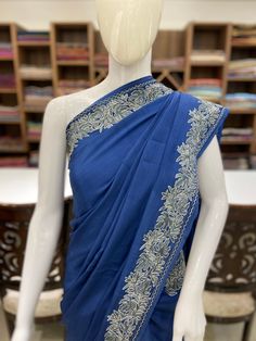 A Marvellous Embroidered Kashmiri Saree which you can wear at any party or a wedding. - - - - - - - - - - - - - - - - - - - -  Product Details - Condition: Brand New (made to order) - Style: Saree Dress - Embroidery: Kashmiri Aari and Tilla Embroidery - Base Colour: Blue or Maroon - Care Instructions: Dry Clean Only F A B R I C Saree: Indian Crepe  Blouse: Indian Crepe F I N I S H - Unstitched You can get it stitched locally. - Stitched Want your blouse ready to wear, let us know the style you want and we will stitch it for you. PLEASE NOTE: We would require you to share certain precise body measurements to stitch the blouse.  If you require guidance on how to take your measurements, please drop us a message. - Blouses are not made to US/UK/EU sizing charts, they are made by measurement. - Wedding Pre-draped Saree With Embroidered Border In Slub Silk, Festive Embroidered Slub Silk Pre-draped Saree, Blue Chanderi Pre-draped Saree With Intricate Embroidery, Anarkali Blouse Piece With Embroidered Border For Reception, Traditional Pre-draped Tussar Silk Saree With Intricate Embroidery, Traditional Drape Embroidered Blouse For Reception, Traditional Pre-draped Saree For Eid Reception, Bollywood Style Pre-draped Saree For Reception With Embroidered Border, Reception Lehenga With Embroidered Border