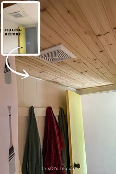 a bathroom with wood paneling and white walls