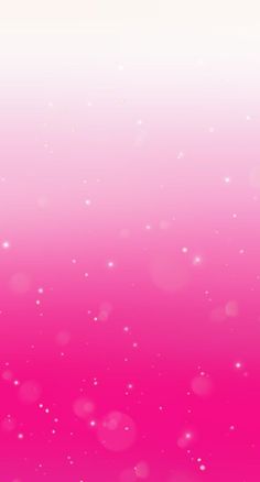 a pink and white background with small bubbles in the air, some are blurry