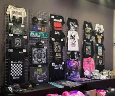 there are many t - shirts hanging on the wall