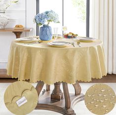 the table is set with plates, silverware and blue vases on top of it