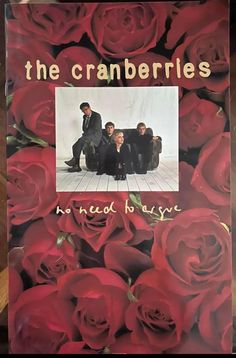 the cranberries in need of love album cover with red roses around it and an image of four men sitting on a couch