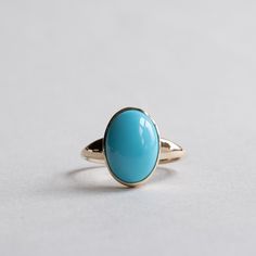 Turquoise set on 14k yellow gold. Metal: 14k Gold Stone: Turquoise Stone Shape: Oval Stone Size:  8mm x 10mm Band Width: Approx 1.4mm band width  This ring is customizable with your choice of gemstones. Please contact us for custom work. LEAD TIME: Made to order will take 10-14 days. Oval Turquoise Cabochon Ring In Yellow Gold, Oval Yellow Gold Turquoise Ring With Cabochon, Heirloom Oval Turquoise Cabochon Ring, Fine Jewelry Turquoise Oval Cabochon Ring, Elegant Turquoise Ring With Polished Finish, Heirloom Style Oval Turquoise Gemstone Ring, Heirloom Yellow Gold Turquoise Cabochon Ring, Classic Yellow Gold Turquoise Gemstone Ring, Oval Turquoise Rings In 14k Gold