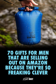 a person holding a blue water bag with the words, 70 gifts for men that are selling out on amazon because they're so freaking clever