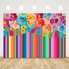 an image of colorful flowers and stripes on a wall in a room with wood flooring