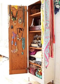 an open closet filled with lots of jewelry