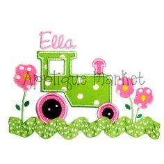 a green train with pink flowers and polka dots