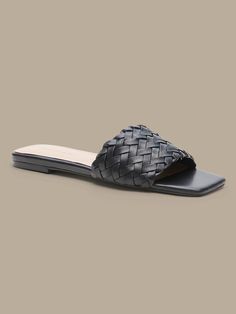 Modern mastery, these square-toe slide sandals have an intricately woven leather construction to add luxurious texture to your look.  Leather uppers.  Leather lining.  Flexible skid-resistant outsole with comfort pod at bottom.  Whole or half sizes. Synthetic Open Toe Mules With Woven Leather, Open Toe Synthetic Slides With Woven Leather, Synthetic Woven Leather Slide Sandals, Synthetic Open Toe Woven Leather Mules, Open Toe Synthetic Woven Leather Mules, Synthetic Woven Leather Open Toe Mules, Synthetic Woven Leather Open Toe Slides, Artisan Woven Leather Slip-on Sandals, Bohemian Woven Leather Slip-on Sandals