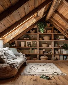 a living room filled with lots of furniture and bookshelves on top of wooden shelves