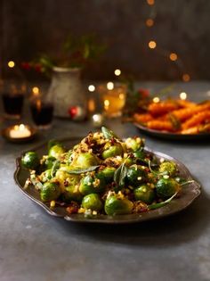 a plate full of brussel sprouts on a table