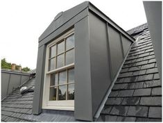 an image of a roof with windows and shingles